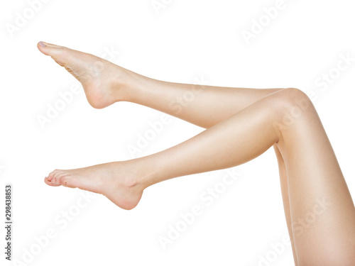 Fotografie, Obraz Beautiful female legs  isolated on white