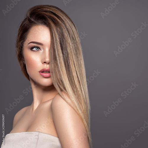 Stampa su tela Young woman with long straight hair. Blond girl.