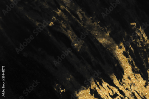 Black and gold marble texture design for cover book or brochure, poster, wallpaper background or realistic business and design artwork. © Tondone