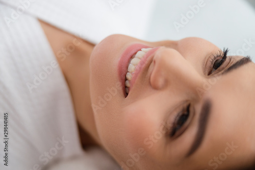 Beautiful young woman demonstrating her charming smile