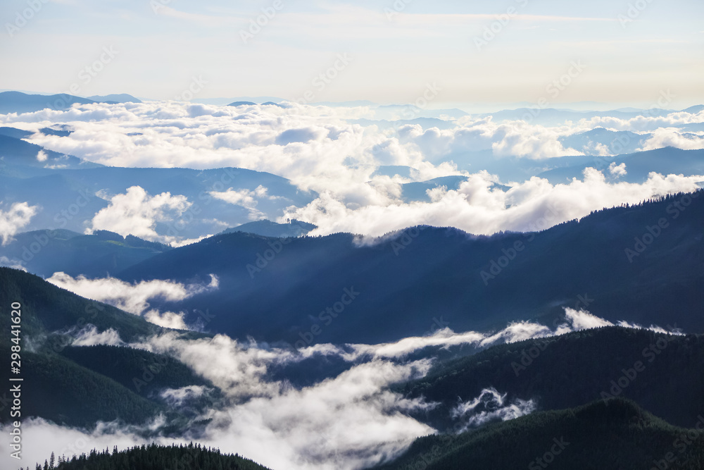 Morning sunny mountains landscape with thick fog, blue sky and clouds. Morning sunny mountains landscape with thick fog, blue sky and clouds.