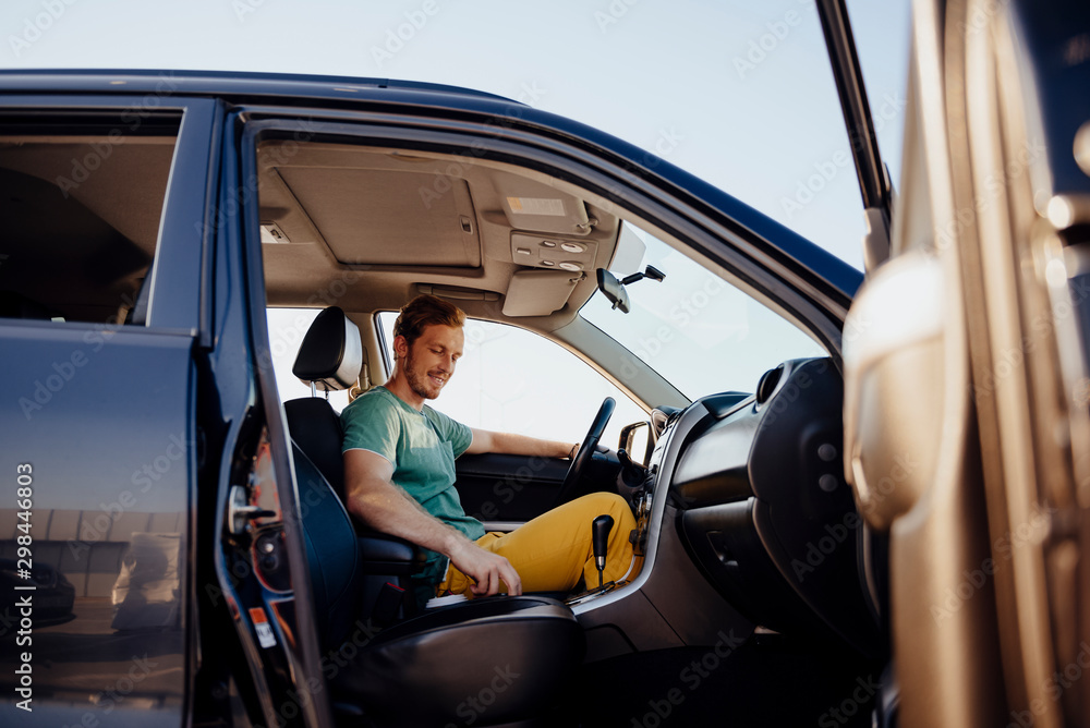 Cheerful man travelling by car stock photo