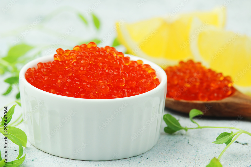 A small ceramic bowl with red caviar A small ceramic bowl with red caviar