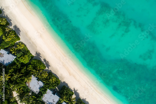 Aerial view of beautiful island at Maldives in the Indian Ocean. Top view from drone. photo