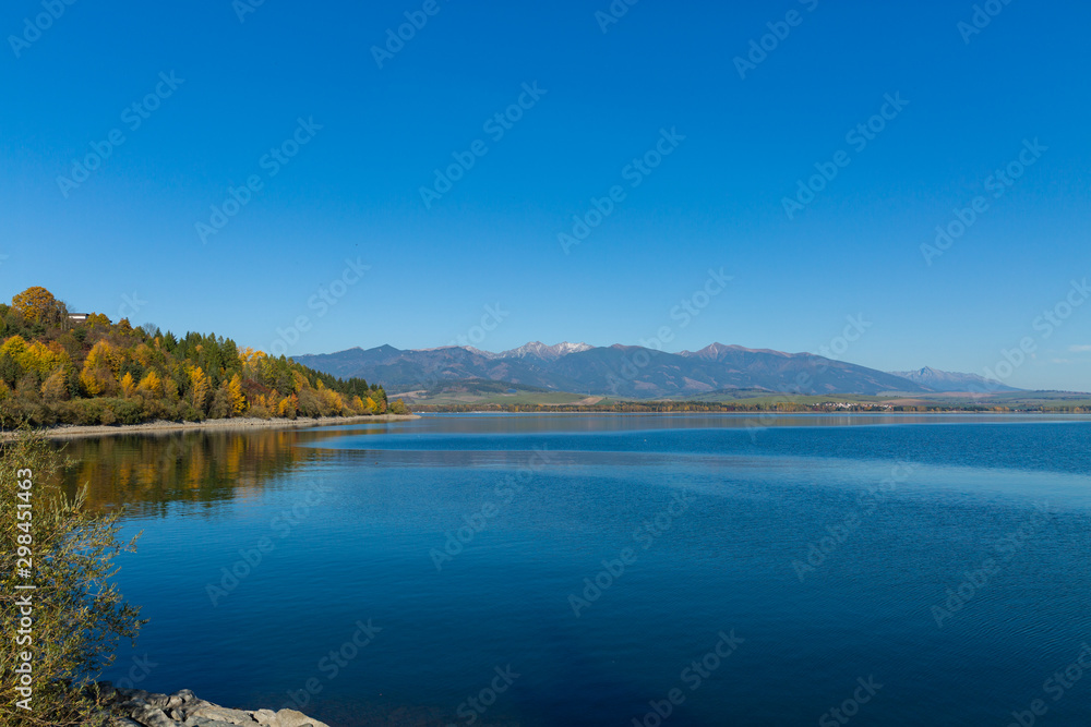 Beautiful nature autumn landscape with colorful forest and lake.Country Slovakia