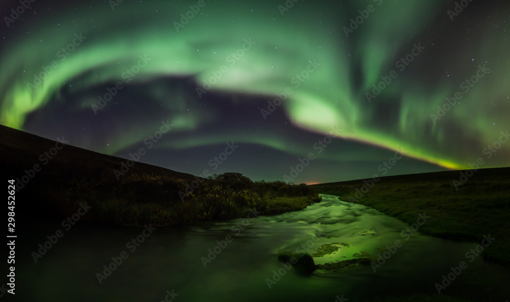 Northern lights with reflection in river, North Iceland Northern lights with reflection in river, North Iceland
