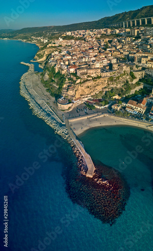 Aerial view of Pizzo Calabro, pier, castle, Calabria, tourism Italy. Panoramic view of the small town of Pizzo Calabro by the sea. Houses on the rock. On the cliff stands the Aragonese castle © Naeblys
