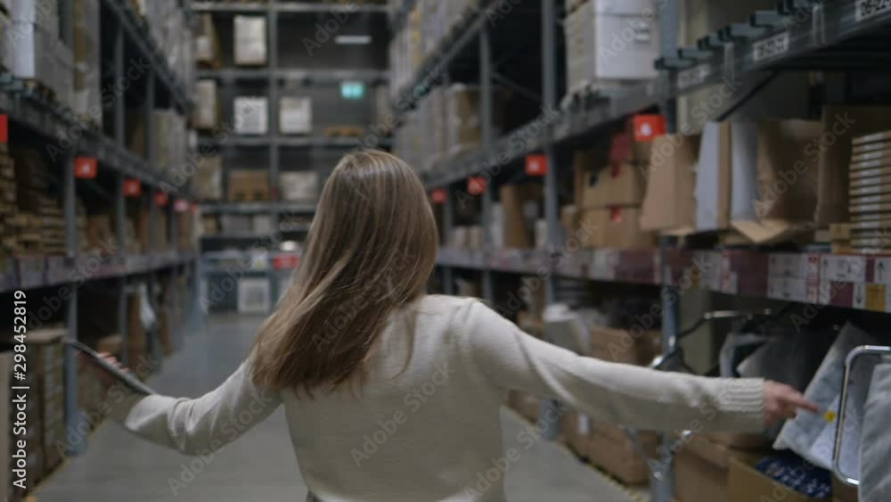 girl turns around and smiles posing for camera in shop girl turns around and smiles posing for camera in shop