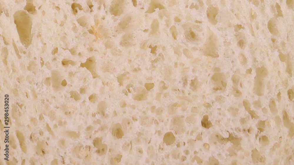 piece of white bread rotates slowly. moving background piece of white bread rotates slowly. moving background