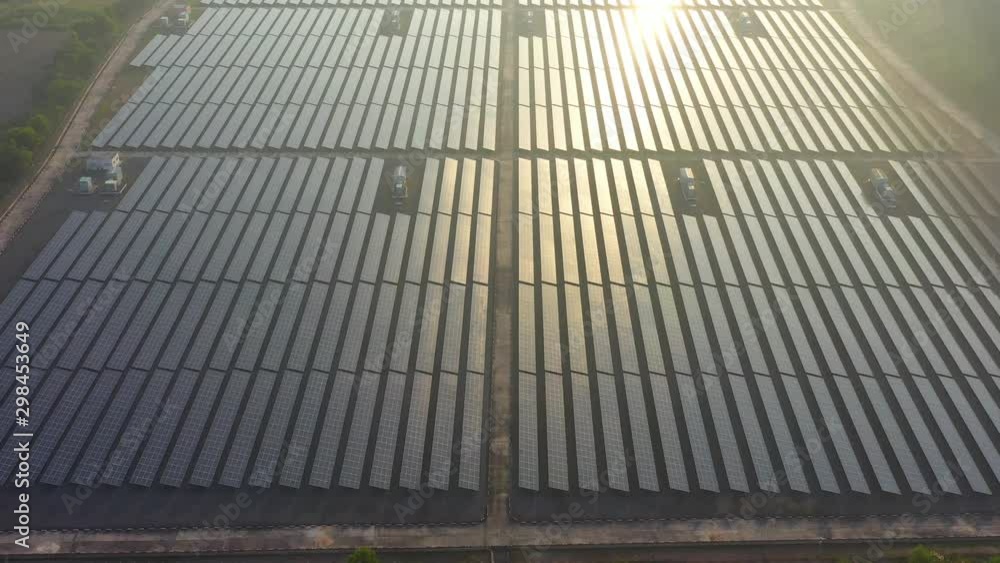 Aerial drone view looking downwards into large solar panels at a solar farm. Solar cell power plants. footage video 4k. Aerial drone view looking downwards into large solar panels at a solar farm. Solar cell power plants. footage video 4k.