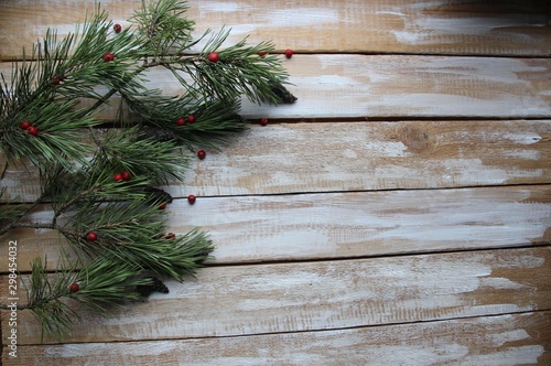 christmas decoration with pine tree on wooden background