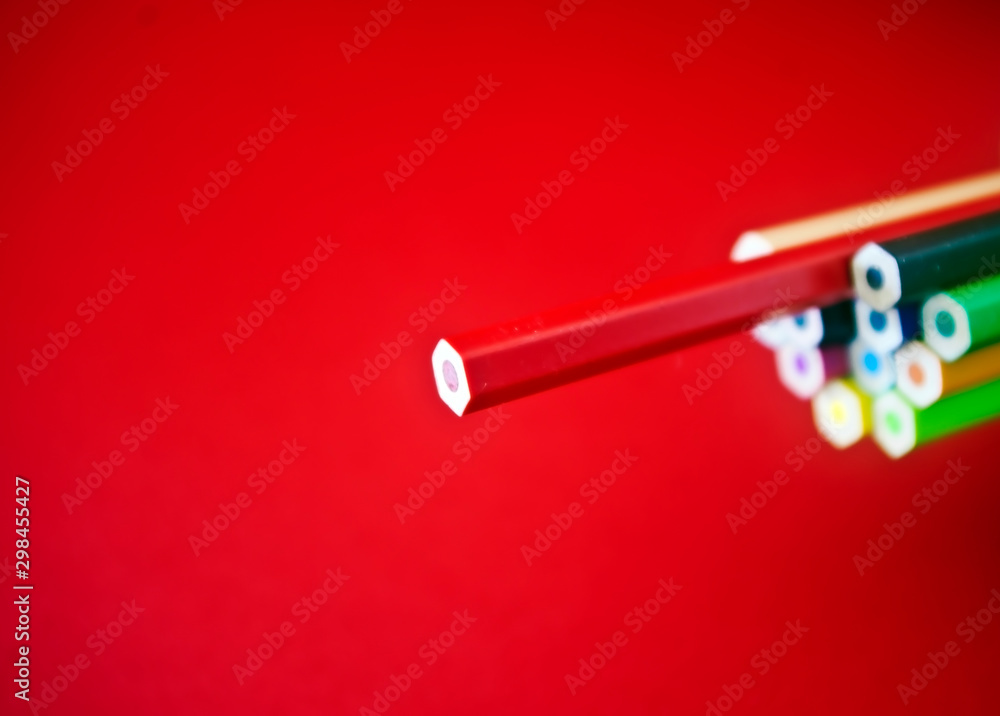 Coloured pencils on red background Coloured pencils on red background