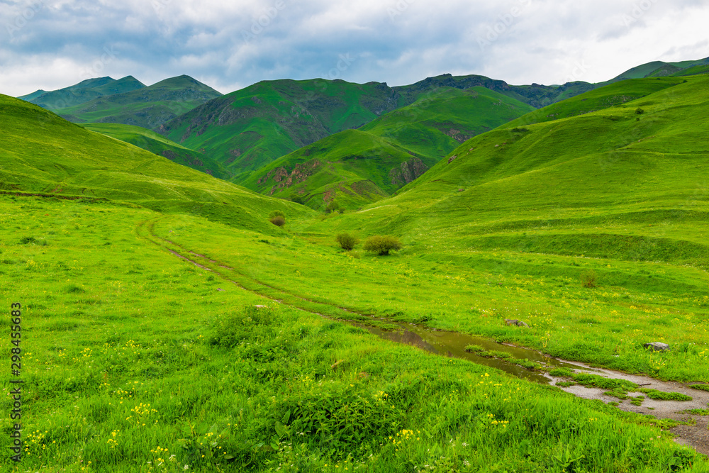 Green mountains of Armenia in early summer, dirt road