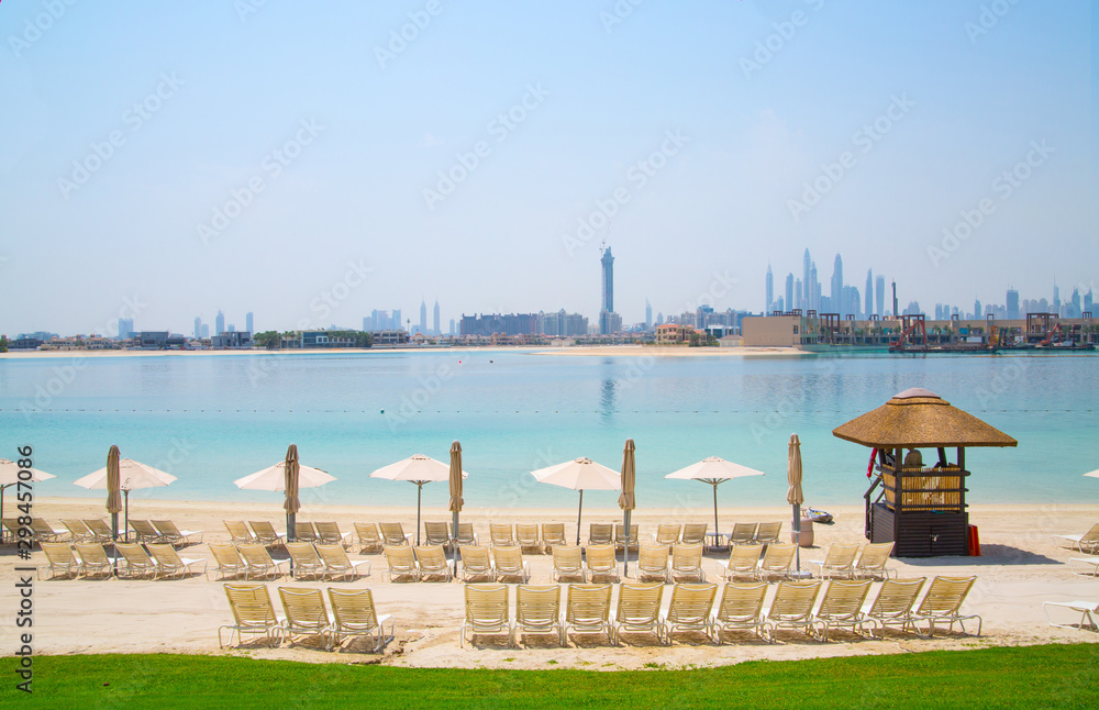 Dubai city skyscrapers view from the beach at the Palm Jumeirah. Dubai, UAE