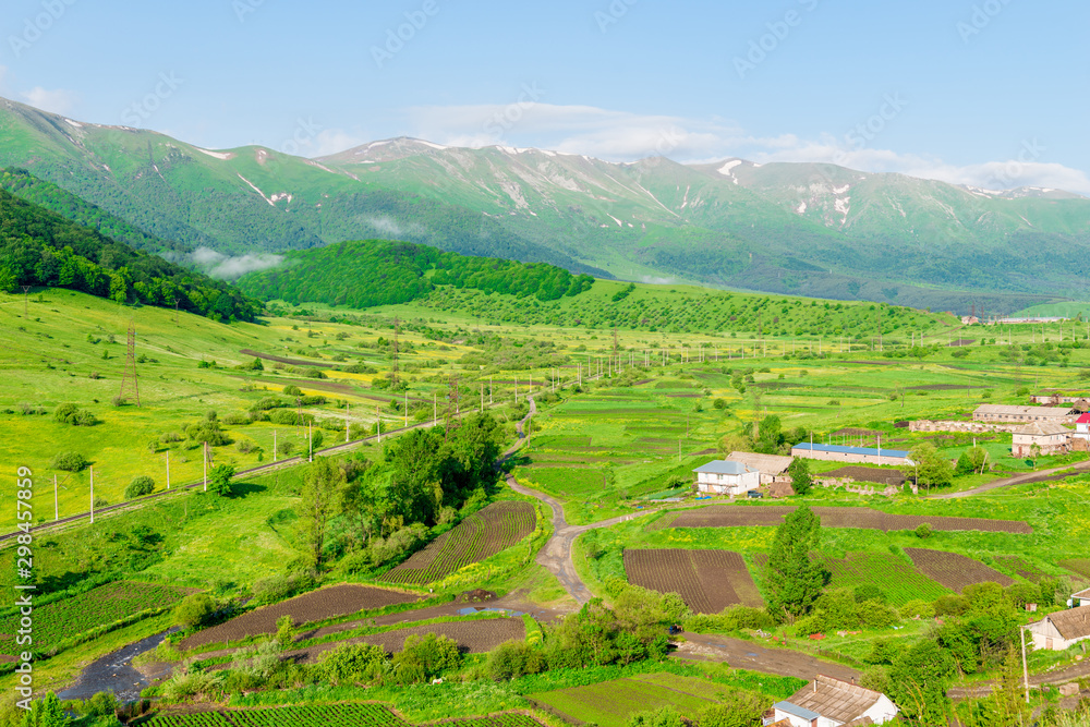 Photo from above Green meadows and forests in the mountains of Armenia in spring