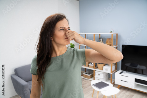 Картината върху платно Woman Covering Her Nose From Bad Smell
