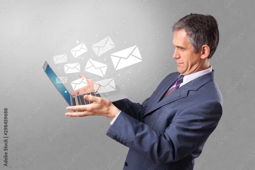 Man holding laptop with business communication concept Man holding laptop with business communication concept