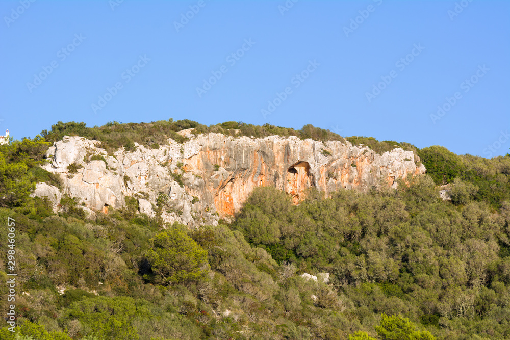 Cliffs next to Son Bou Beach in a seaside town in the south of Menorca. Spain