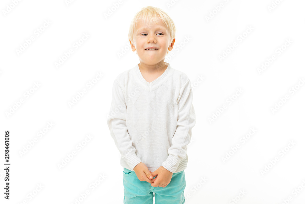 Little boy with short blonde hair, blue eyes, cute appearance, in white jacket, light blue pants, standing and shy Little boy with short blonde hair, blue eyes, cute appearance, in white jacket, light blue pants, standing and shy