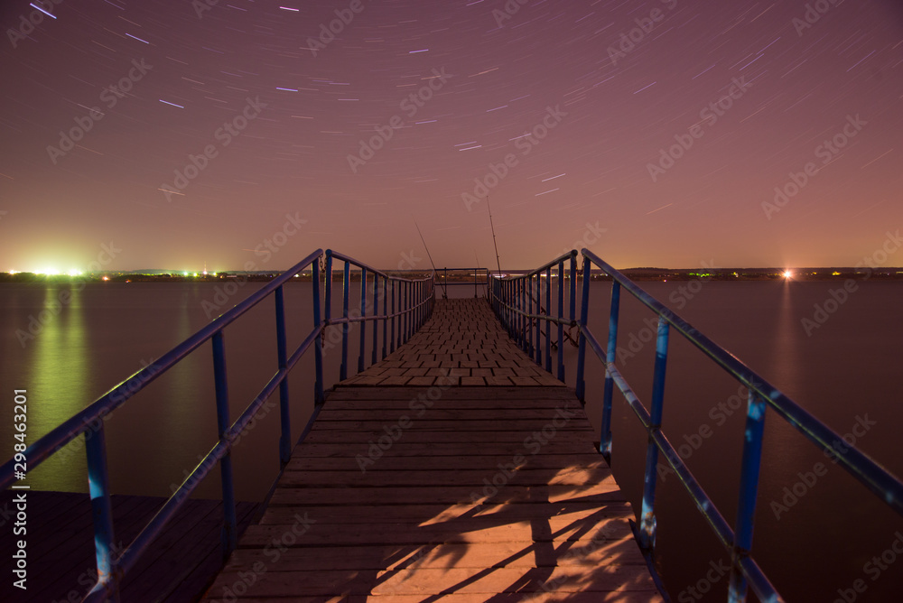 Obraz premium Night bridge, stars and fishing, night landscape