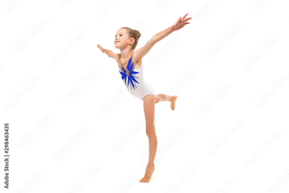 girl gymnast in white trico in full height performs in a white jump isolated on a white background