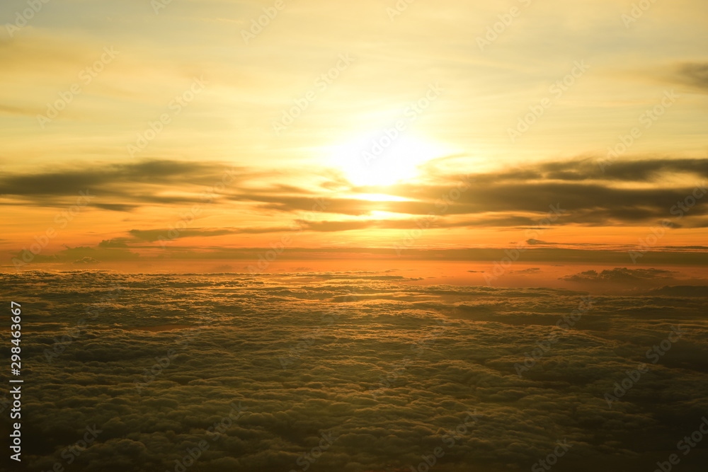 Golden yellow sky and beautiful clouds. During the setting sun Viewed from a high angle on the plane