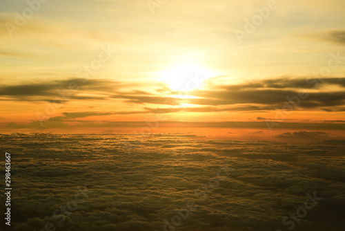 Golden yellow sky and beautiful clouds. During the setting sun Viewed from a high angle on the plane