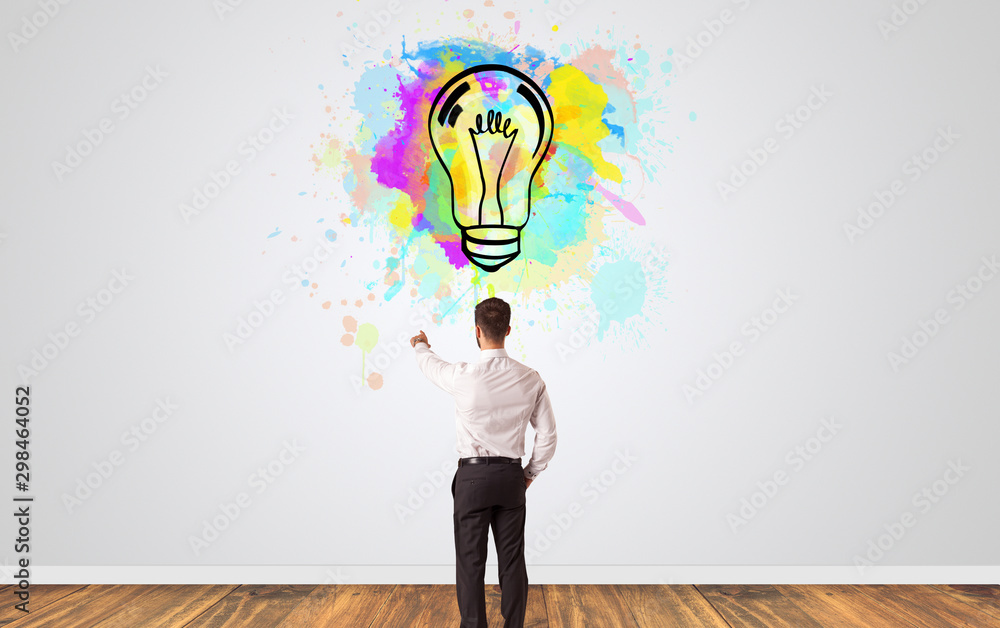 Businessman looking to a wall with new idea concept Businessman looking to a wall with new idea concept