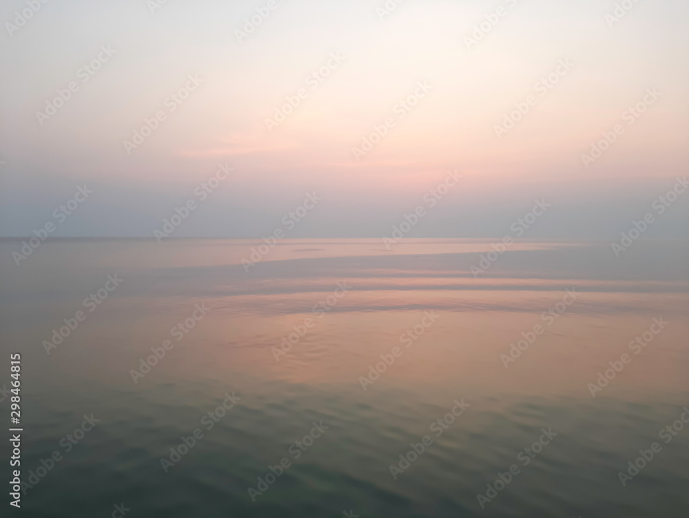 Indigo sea with an orange sky at dawn Indigo sea with an orange sky at dawn