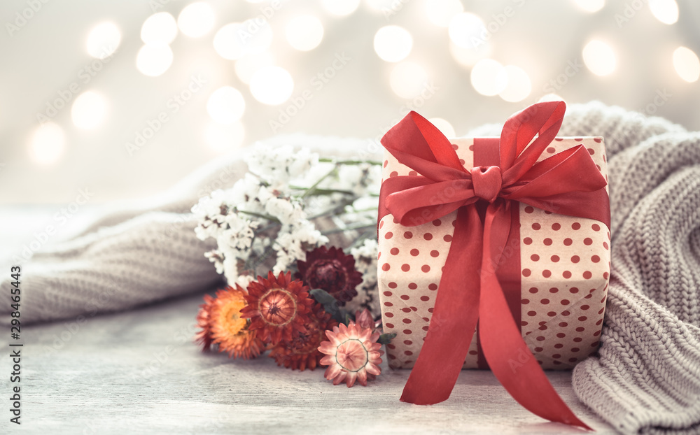 Background holiday, gift in a beautiful box with a red bow . Background holiday, gift in a beautiful box with a red bow .