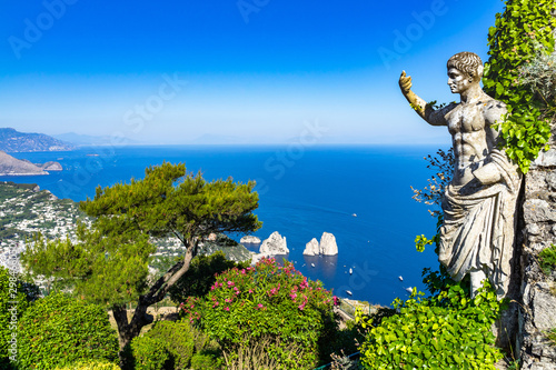 Scenic view of Capri from Monte Solaro with Statue of Emperor Augustus and the Faraglioni in the background  Italy