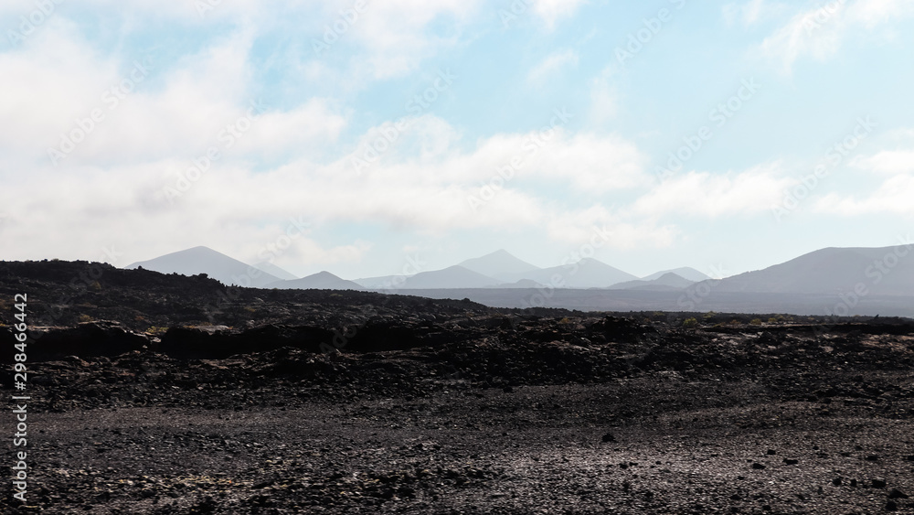 Black and rocky mountains in volcanic landscape Black and rocky mountains in volcanic landscape