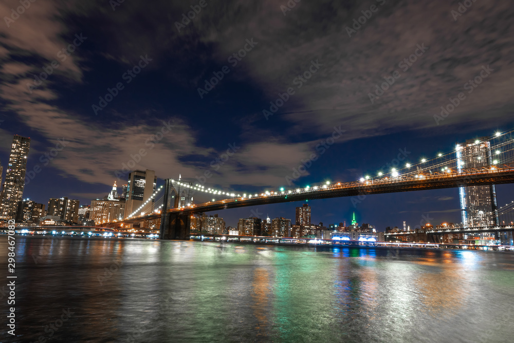 Skyline of Manhattan and Brooklyn bridge, night view Skyline of Manhattan and Brooklyn bridge, night view