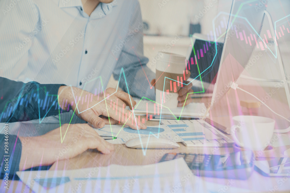 Multi exposure of chart with man typing on computer in office on background. Concept of hard work. Multi exposure of chart with man typing on computer in office on background. Concept of hard work.