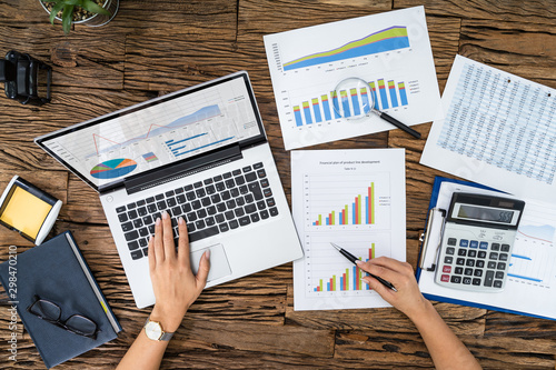 Businesswoman Analyzing Financial Chart On Computer