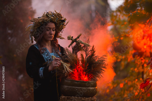 Woman sitting in burning pentagram circle, magic.