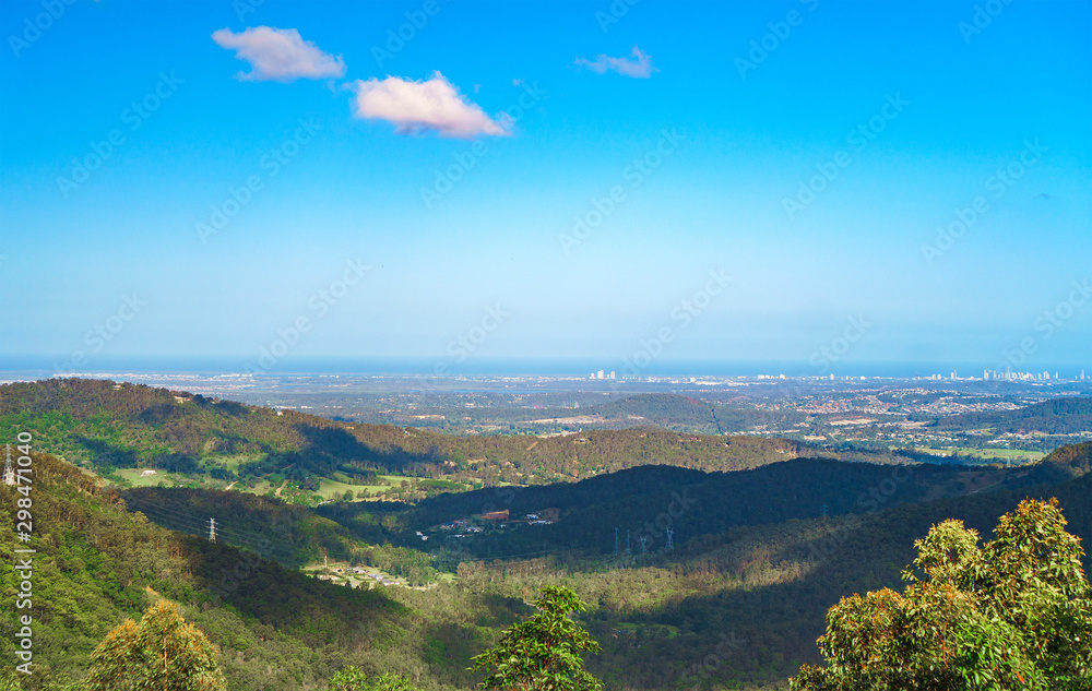 Stunning panoramic view of the Gold Coast city skyline visible from the peak of Tamborine Mountain, Queensland, Australia.