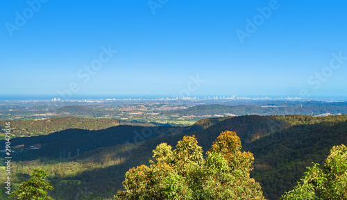 Stunning panoramic view of the Gold Coast city skyline visible from the peak of Tamborine Mountain, Queensland, Australia.