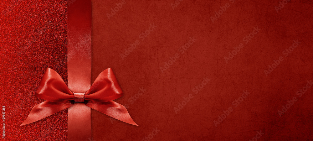 gift card wishes merry christmas background with red ribbon bow on red shiny vibrant color texture template with blank copy space - obrazy, fototapety, plakaty 