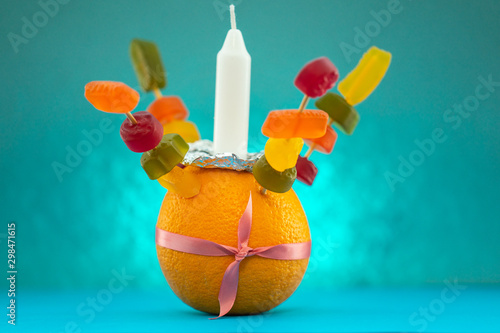 Orange Christingle is a symbolic object used in the Advent, Christmas and Epiphany services of many Christian denominations photo