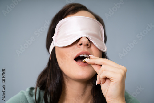 Blindfolded Young Woman Testing Food photo