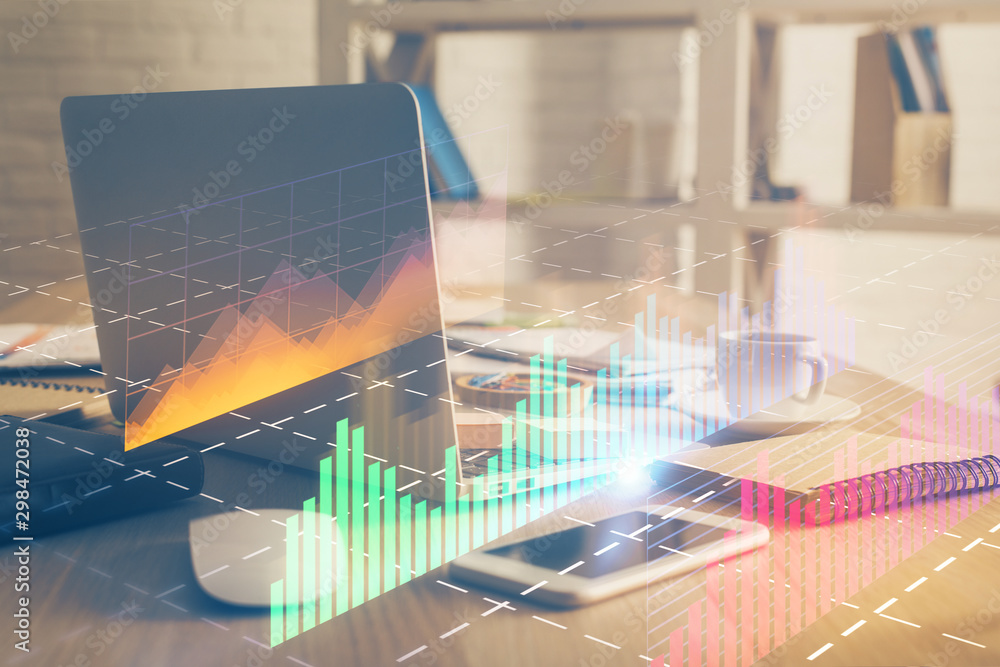 Financial chart drawing and table with computer on background. Double exposure. Concept of international markets. Financial chart drawing and table with computer on background. Double exposure. Concept of international markets.