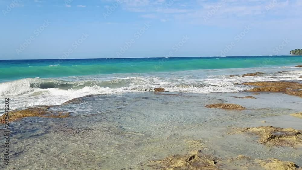 clean rocky beach, blue sky and beautiful waves clean rocky beach, blue sky and beautiful waves