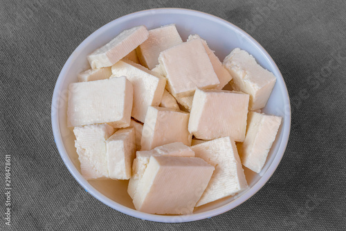 Paneer cottage cheese close up, slice pieces of homemade fresh white raw panner cheese.