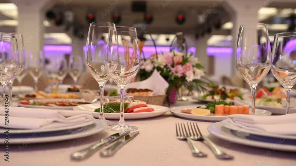 Banquet decorated table, with cutlery. Wedding decor in the banquet hall. Banquet decorated table, with cutlery. Wedding decor in the banquet hall.