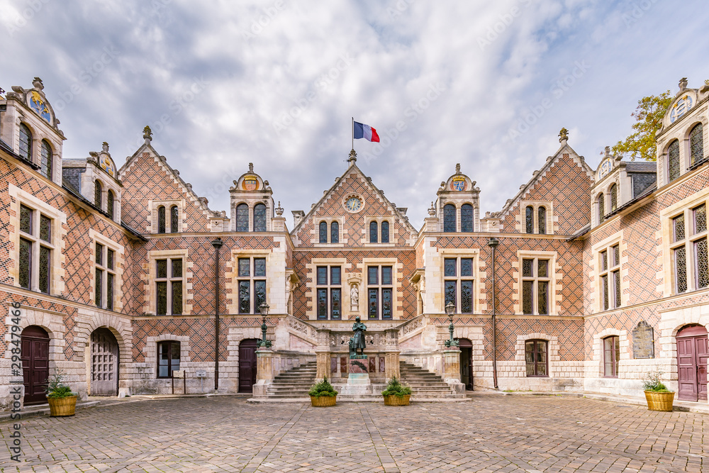 Ancient renaissance building Hotel Groslot with statue of Jeanne D arc, in use as town hall in Orleans France