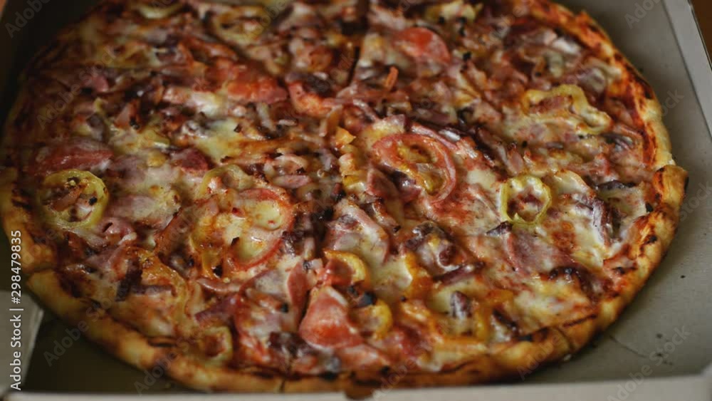 open a box with a big tasty Italian pizza open a box with a big tasty Italian pizza