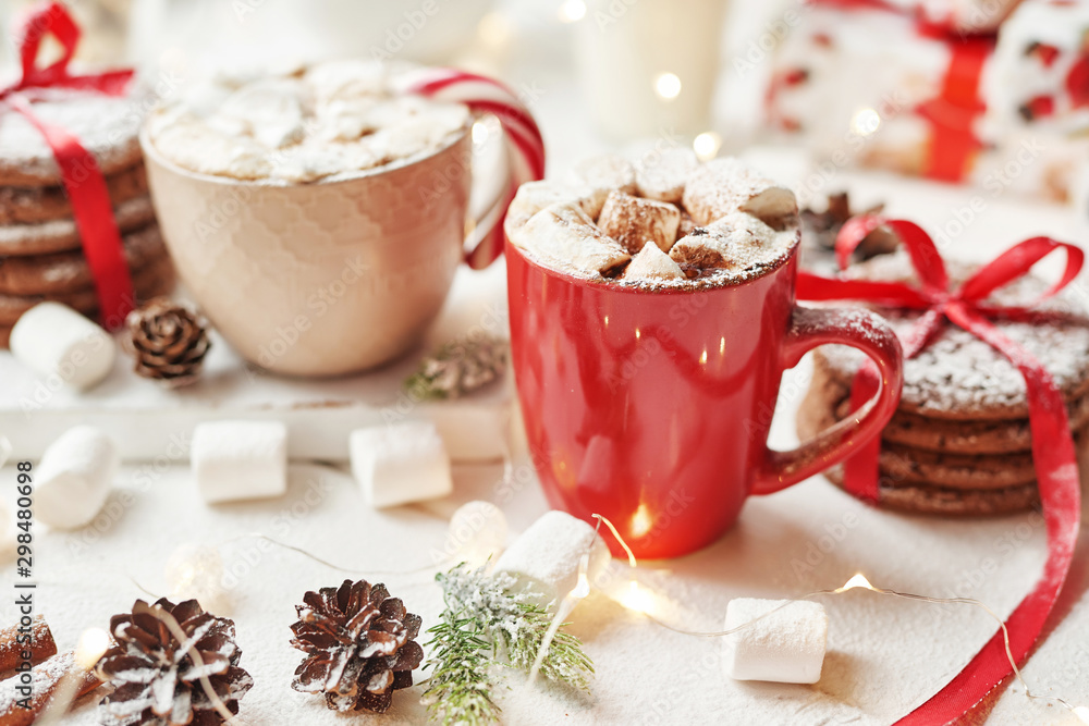 Christmas cookies, milk, cocoa, marshmallows, candies on a white plate by the window Christmas cookies, milk, cocoa, marshmallows, candies on a white plate by the window