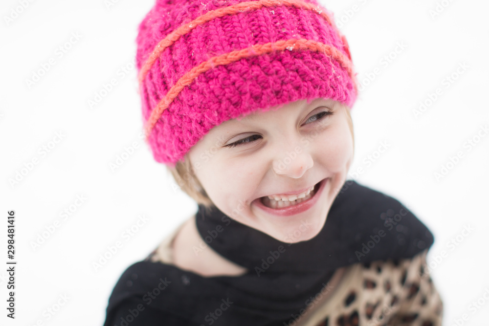 Adorable little girl playing in the winter snow Adorable little girl playing in the winter snow