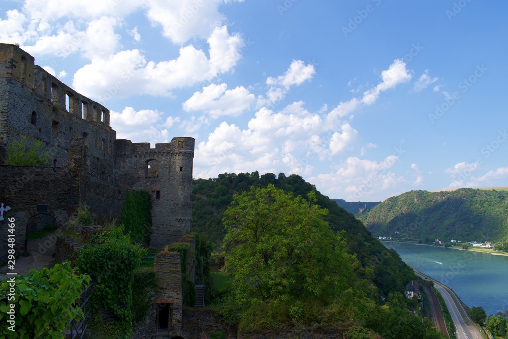 Looking at castle ruins on hill with river in background